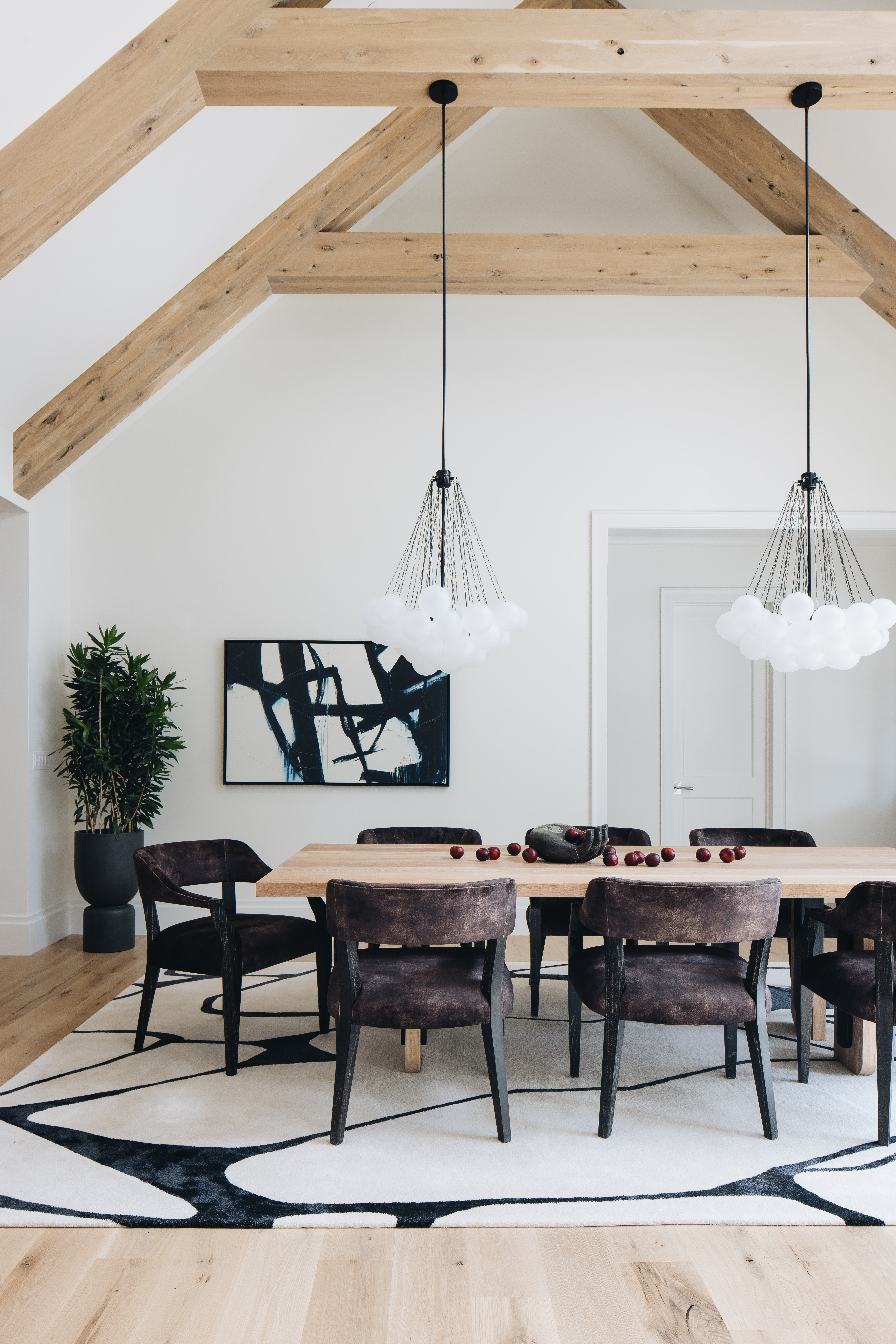 Bright kitchen with black stone and oak cabinetry